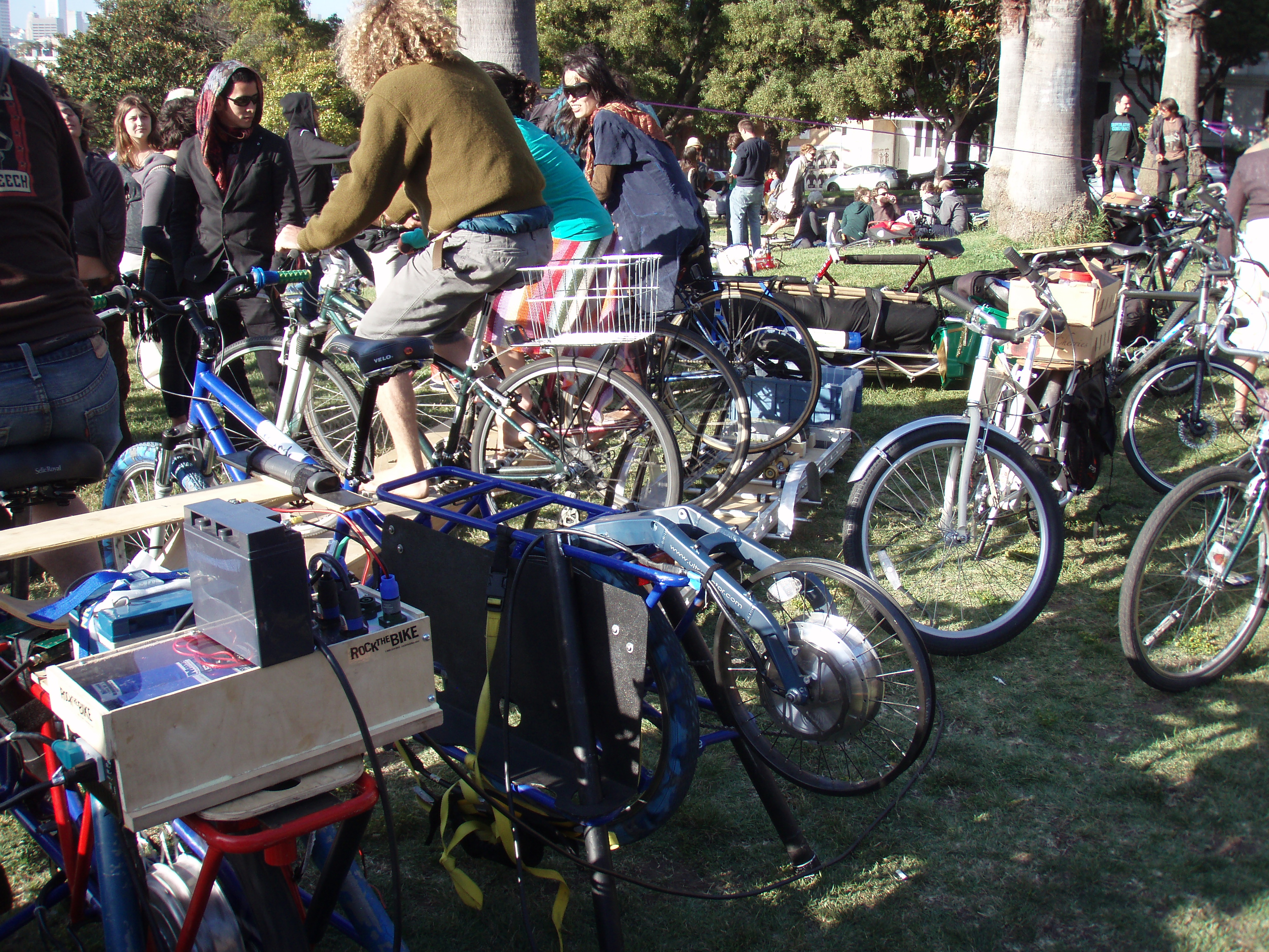 This is the power-generating setup they used.  5 bikes in total, the three far bikes were all connected to the same unit.