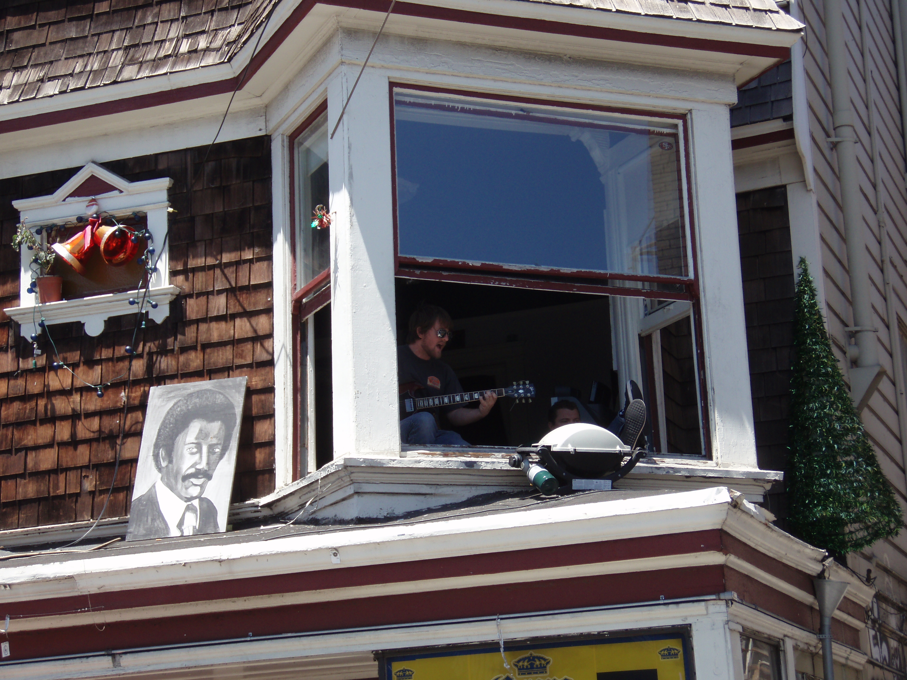Sunday Streets - 2nd Flow guitarist Some guy was rocking out from the 2nd floor of his apartment. Bonus points for rocking the aviators <i>indoors</i> and having a grill on your roof that was too off-camber to use effectively.